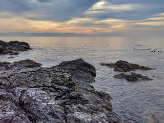 Fototapeta na wymiar scenic view of the San Juan Island rocky coast with rolling, overcast clouds