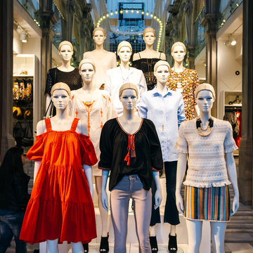 Athens, Greece - 26 Mar 2016: Square image of Mannequins wearing H and M fashion clothes inside store on Ermou 54 street with multiple led lights inside the old vintage building