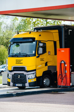 Nice, France - May 7, 2016: New electric friendly Renault T520 Yellow Truck from the Formula One Sport Team at Total French gas station carrying the fast turbocharged Renault F1 Grand Prix