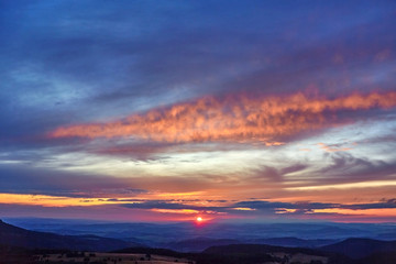 Sunset seen from Szczeliniec Wielki peak in Table Mountains, Poland