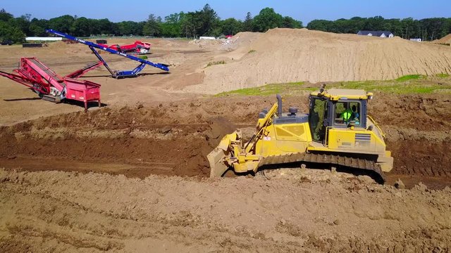 A Dozer Moving Dirt Arc Shot