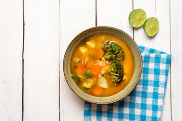 Vegetables soup with rice on white background