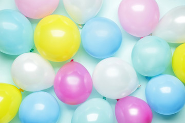 Fototapeta na wymiar Birthday air balloons on color background