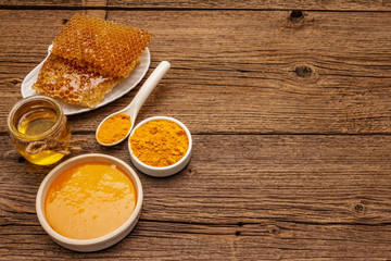 Spa concept. Self care with honey and turmeric. Natural organic cosmetics, homemade product, alternative lifestyle. Vintage background