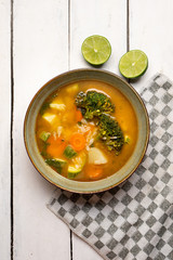 Vegetables soup with rice on white background