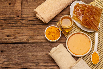 Spa concept. Self care with honey and turmeric. Natural organic cosmetics, homemade product, alternative lifestyle. Vintage background
