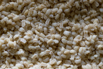 boiled pearl barley top view food background