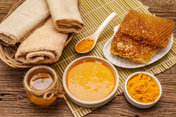 Spa concept. Self care with honey and turmeric. Natural organic cosmetics, homemade product, alternative lifestyle. Vintage background