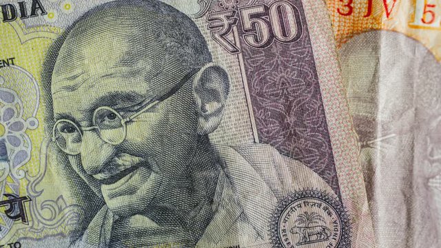 India ten and fifty rupee banknotes macro detail stop motion time lapse 4k