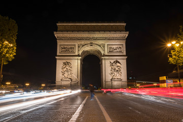 Traffic on the Champs-Elysees in Paris/France - obrazy, fototapety, plakaty