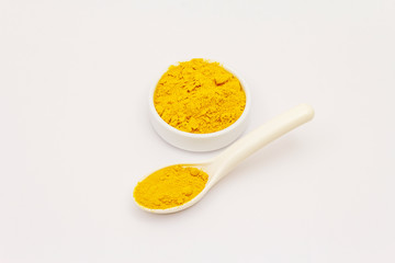 Dry turmeric powder isolated on white background