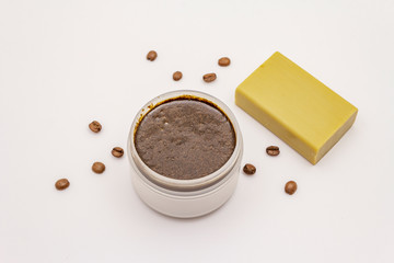 Coffee body scrub and soap isolated on white background. Spa concept, homemade cosmetics from natural ingredient