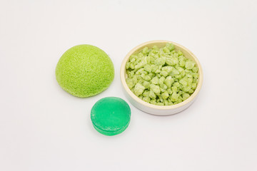 Sea salt, green tea soap and sponge isolated on white background