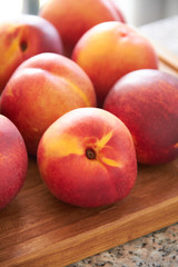 Fresh Peaches on a cutting board