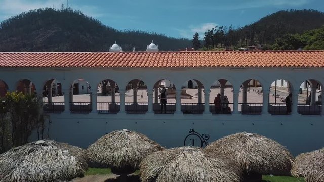 Drone Footage "pull away" shot of an Asian girl on vacation at 