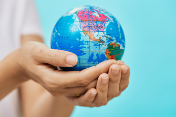 Woman Holding Globe in her Hands