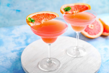 Glasses of tasty mimosa cocktail on table