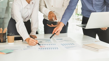 Asian business adviser meeting to analyze and discuss the situation on the financial report in the...