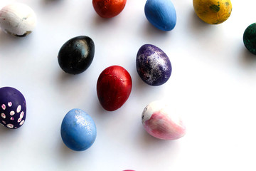 Multicolored quail easter eggs isolated on white background, top view