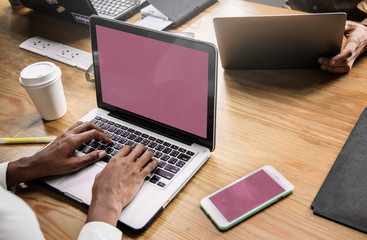 People working on a laptop in a meeting