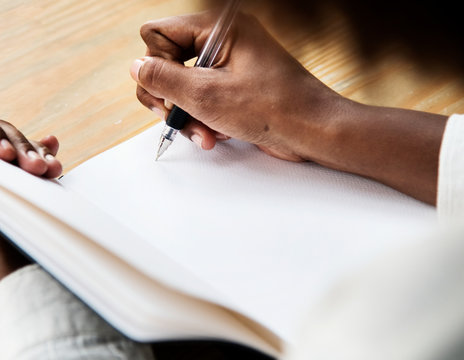 Woman writining in a notebook