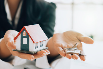 House model and key on table for finance and banking concept.Home purchase mortgage concept.