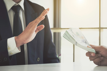 Business man refusing money to take the bribe the concept of corruption and anti bribery