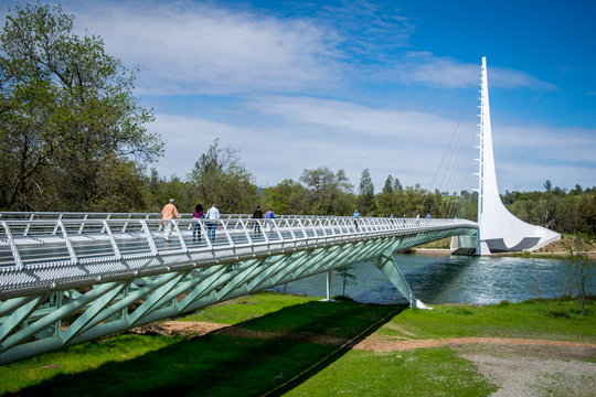 Sundial Bridge At Turtle Bay Against Cloudy Sky On Sunny Day