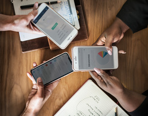 Businesswomen using phones for work