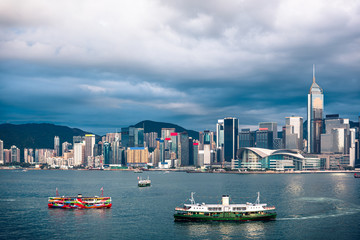 Fototapeta premium Panorama of Hong Kong City skyline from across Victoria Harbor; with Sunlight effect