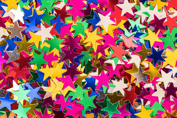 Colorful star sequin glitter textured background abstract