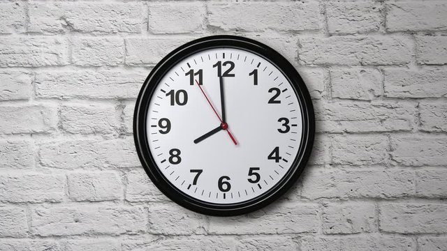 The Time Is 8.00 AM Or PM On A Black Wall Clock With A Red Second Hand On A White Brick Wall.