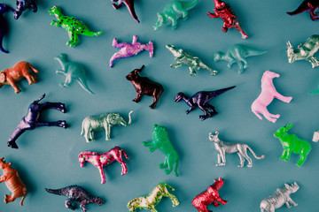 Various animal toy figures in a colorful background