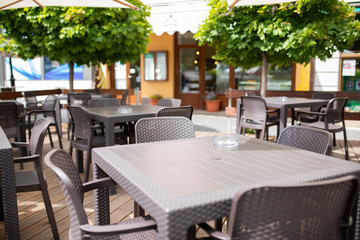 restaurant on the street without people. The interior of a summer restaurant without people. Covid-19