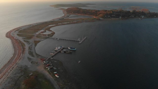 Aerial over small danish Island at sunset in fall