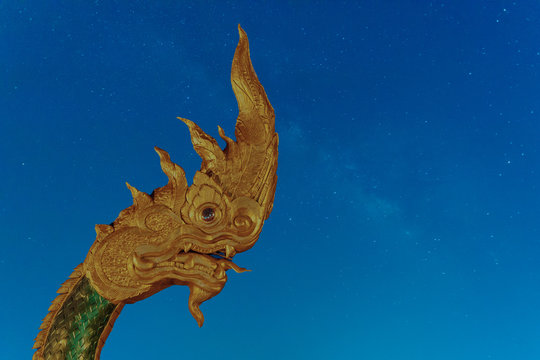 Phayanak Golden King of Naga Heads  Statue   Isolated on milky way background