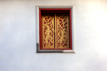 Isolated vintage windows on white wall at Luangpabang Laos