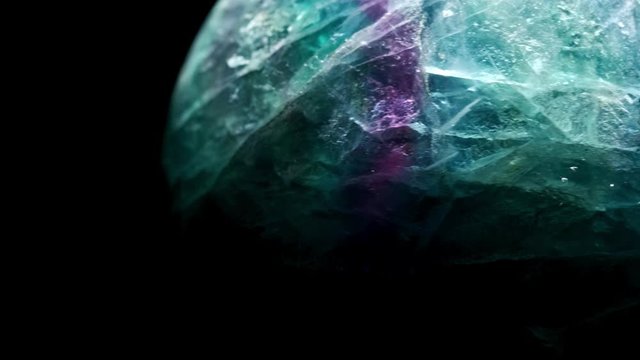 Macro mineral stone Fluorite crystal on a black background close-up