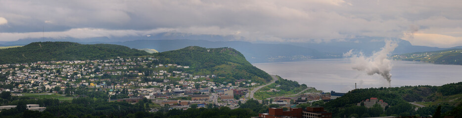 Fototapeta na wymiar Panorama Of Corner Brook Newfoundland on the Bay of Islands with Pulp and Paper Mill stack