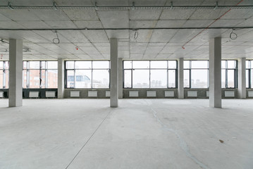 Fototapeta na wymiar empty pure commercial office building undecorated in gray colors.open space office