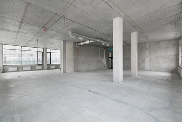 empty pure commercial office building undecorated in gray colors.open space office