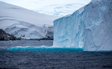 Icebergs floating in the Antarctic after calving off the numerous glaciers in the area.