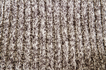 Knitted pattern as a background design; close up of ribbed texture on a knitted blanket