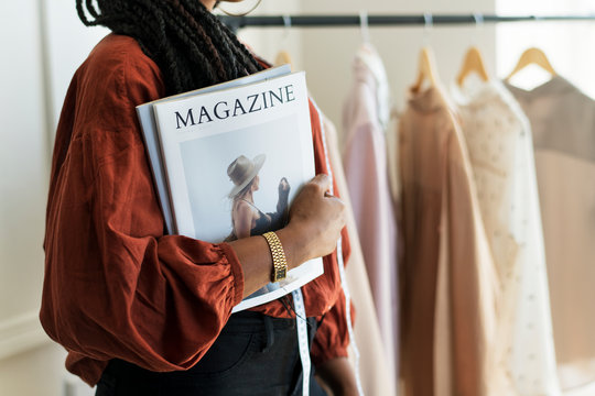 Designer holding a magazine