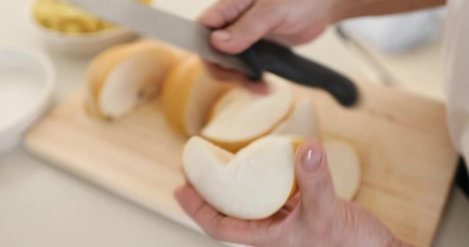 Peeling pears's skin on cutting board