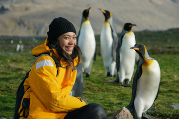 Smiling Woman in front of Penguins