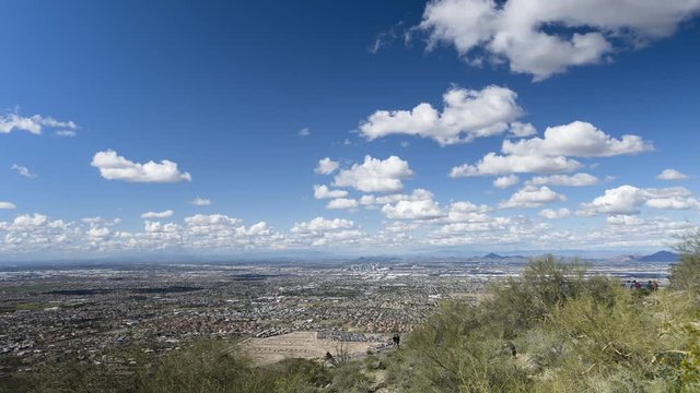 Phoenix, Arizona - March 14 2020: Looking across Phoenix from Dobbins Lookout in a wide timelapse as clouds flow overhead.
