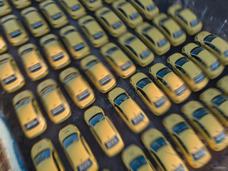 Aerial drone view of yellow taxi cab parking lot with yellow cars standing, set of taxicabs in the...