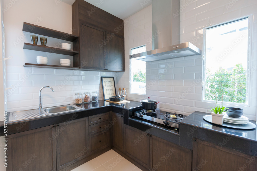 Wall mural Kitchen sink and faucet. Stainless kitchen sink and tap water. The interior of the modern kitchen room.