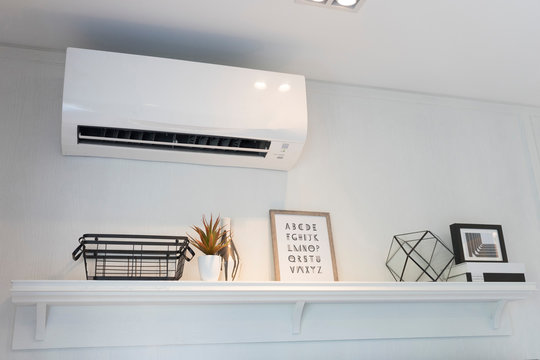 Air Conditioner Split Type Embed On Wall Of Living Room.